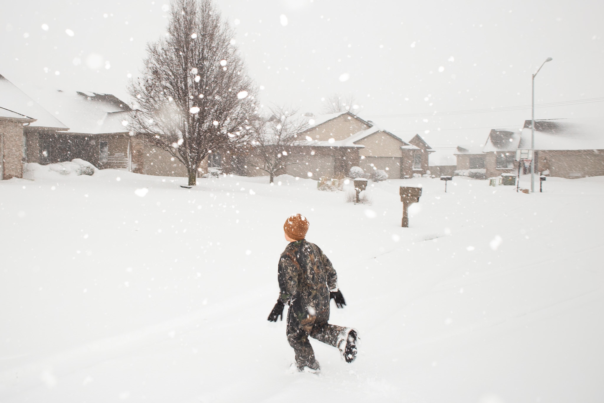 kid running in snow