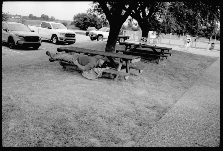 man laying on bench